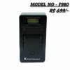 Black FOTOKINA NP-F980 series battery charger with an LCD display slot, compatible with Sony F-series batteries, marked with a price of 'RS 699/-'.