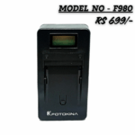 Black FOTOKINA NP-F980 series battery charger with an LCD display slot, compatible with Sony F-series batteries, marked with a price of 'RS 699/-'.