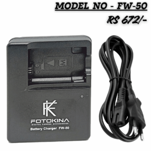 FOTOKINA digital camera battery charger (Model FW-50) for Sony NP-FW50 type batteries, shown next to its black AC power cable. The charger is black and features the FOTOKINA logo. Text overlays indicate 'MODEL NO - FW-50' and the price 'RS 672/-'.