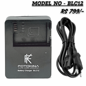 A black FOTOKINA BLC12 Digital Camera Battery Charger, designed for BLC12 batteries, shown next to its black AC power cable with a 2-pin European/Indian plug. The text overlays read "MODEL NO - BLC12" and "RS 799/-".