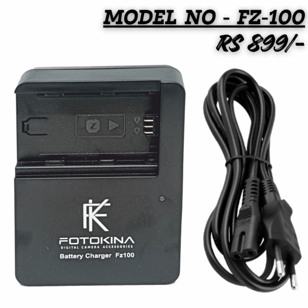 "FOTOKINA FZ-100 Digital Camera Battery Charger, black, shown with a two-pin AC power cord. The charger features an LED indicator and is clearly marked with the model number 'FZ100'."